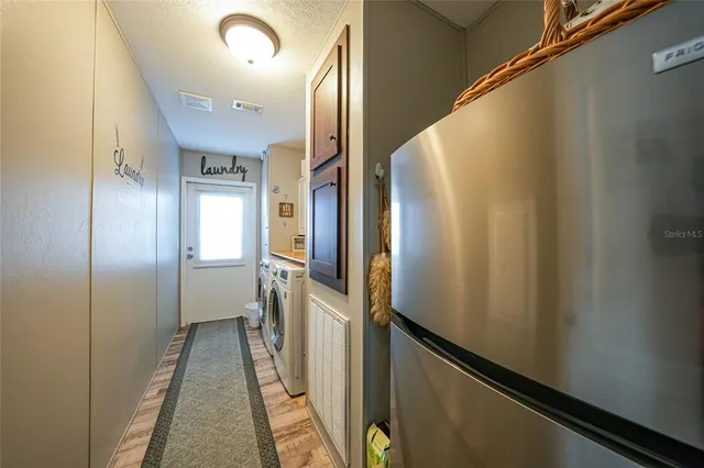 a utility room with closet dryer and washer