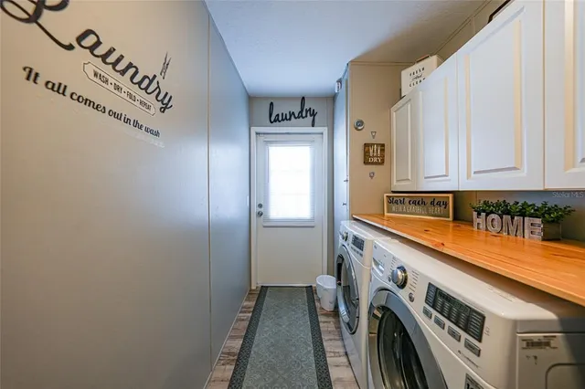 a view of a house with a wooden fence