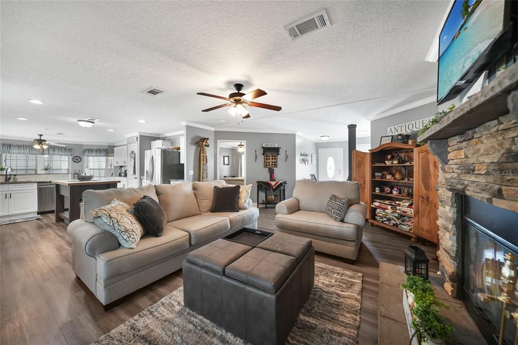 14 North Cardinal, Unit B14 Punta Gorda, FL 33950 - Photo 7 of 40 a living room with furniture ceiling fan and a rug
