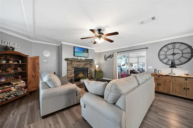a living room with furniture and a fireplace