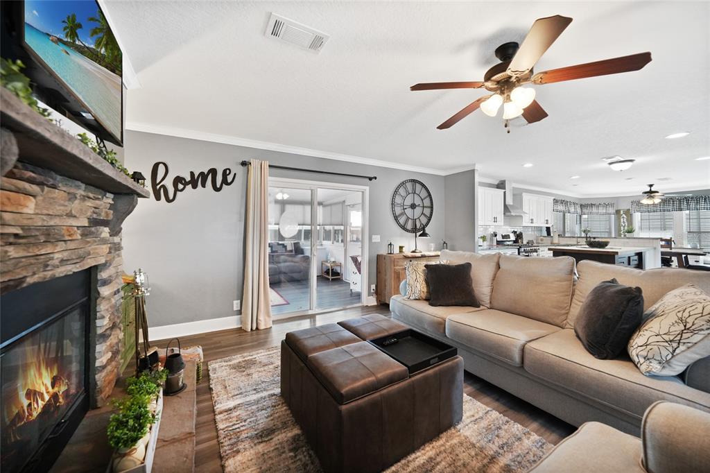 14 North Cardinal, Unit B14 Punta Gorda, FL 33950 - Photo 9 of 40 a living room with furniture kitchen view and a fireplace