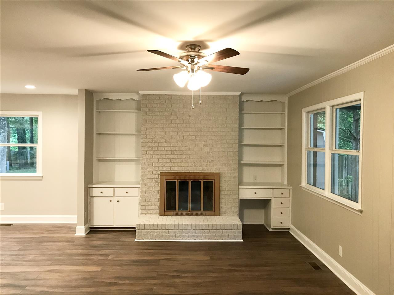 932 Bluestone Road Durham, NC 27713 - Photo 5 of 18 Cozy family room with wood burning fireplace and bookshelves/storage. Side entry to carport. Family Room