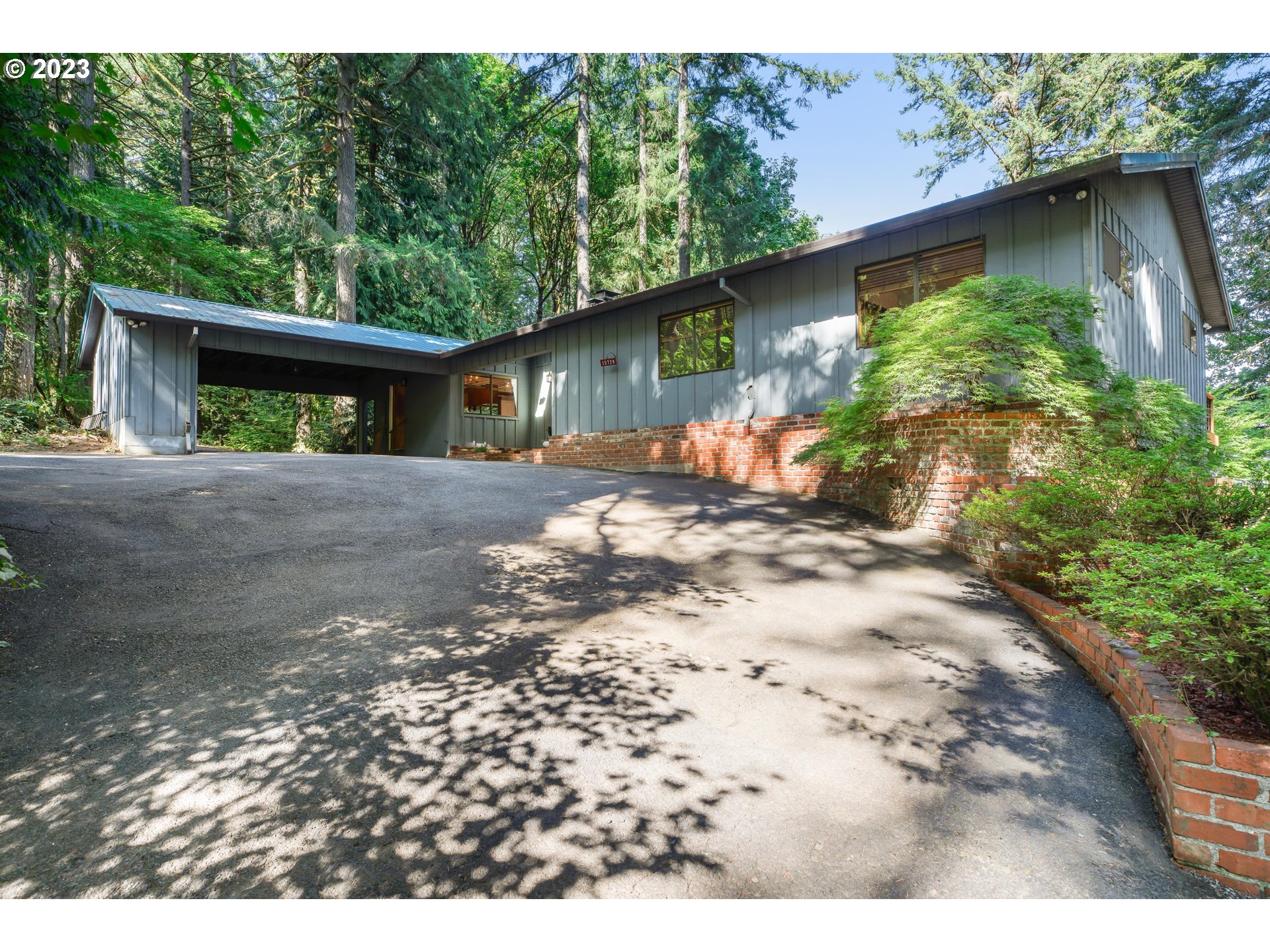 15729 Northwest Sheltered Nook Road Portland, OR 97231 - Photo 1 of 44 a front view of a house with a yard