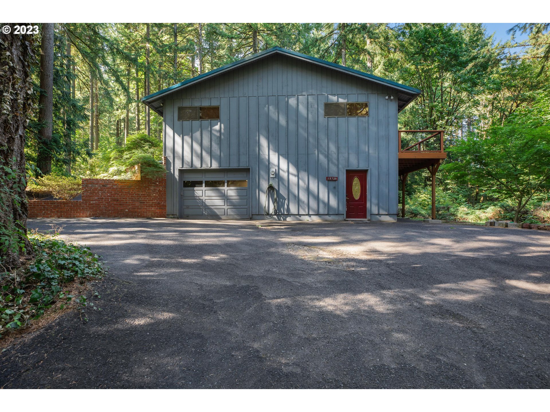 15729 Northwest Sheltered Nook Road Portland, OR 97231 - Photo 11 of 44 a view of a house with a yard