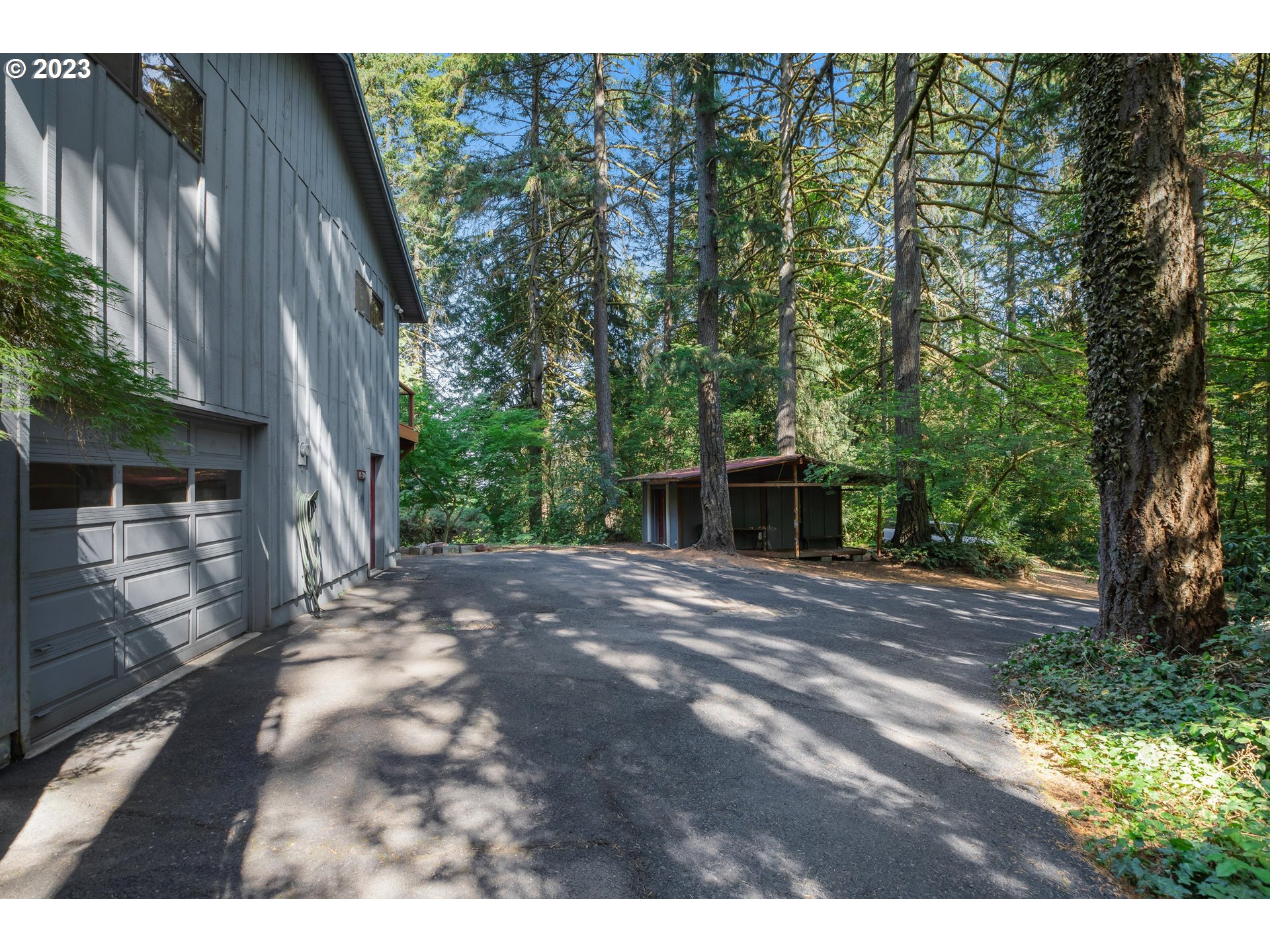 15729 Northwest Sheltered Nook Road Portland, OR 97231 - Photo 12 of 44 a front view of a house with yard