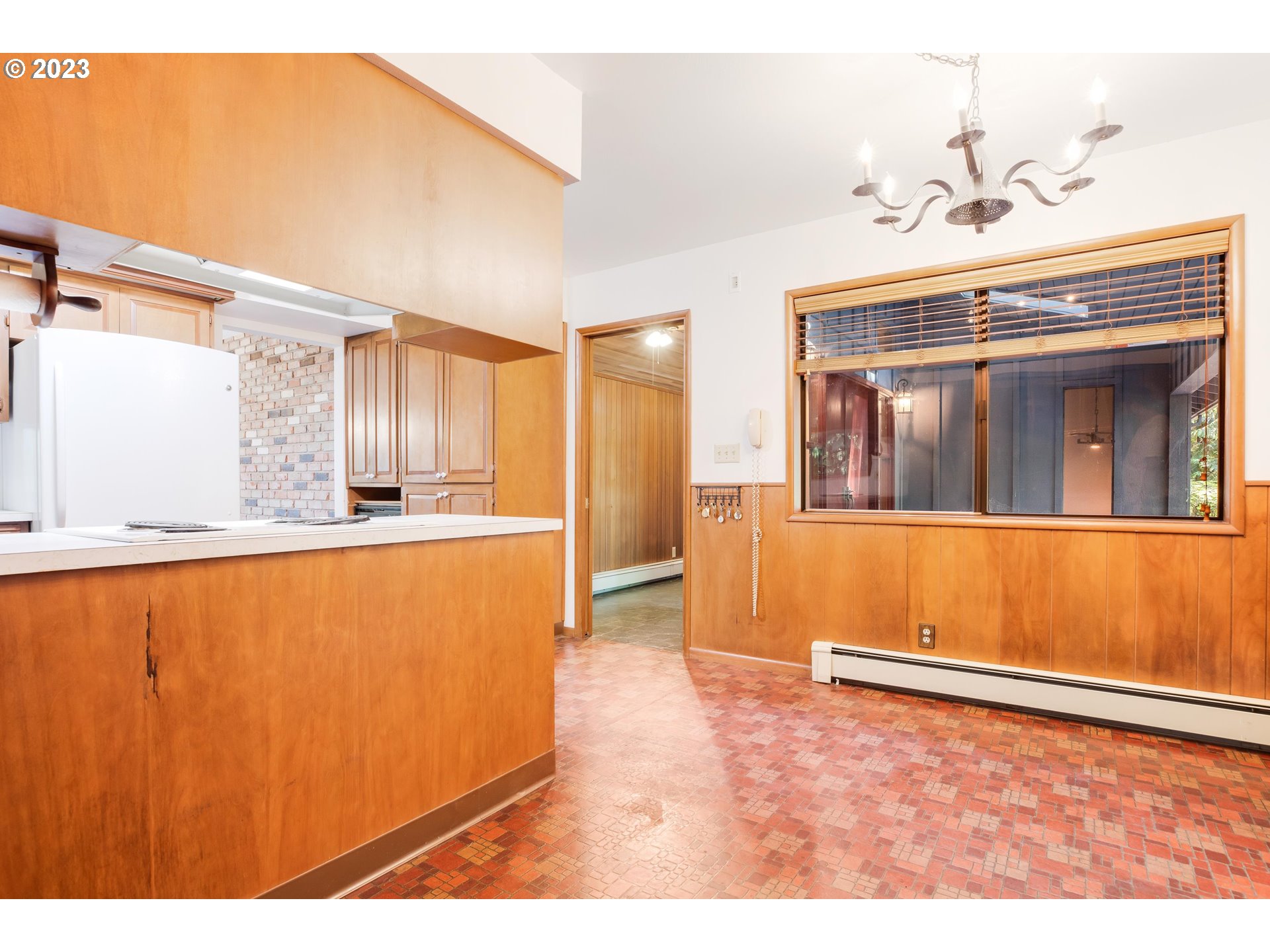 15729 Northwest Sheltered Nook Road Portland, OR 97231 - Photo 19 of 44 a view of an empty room with kitchen view