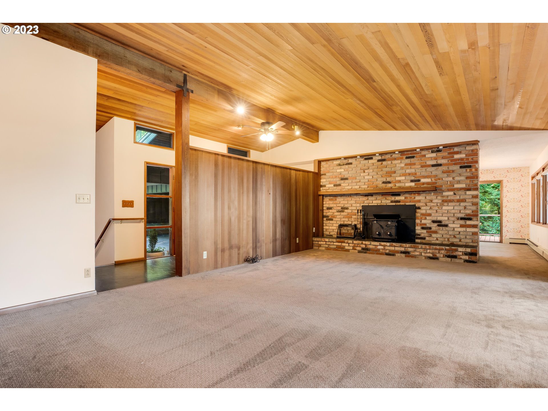 15729 Northwest Sheltered Nook Road Portland, OR 97231 - Photo 24 of 44 a view of a livingroom with a fireplace