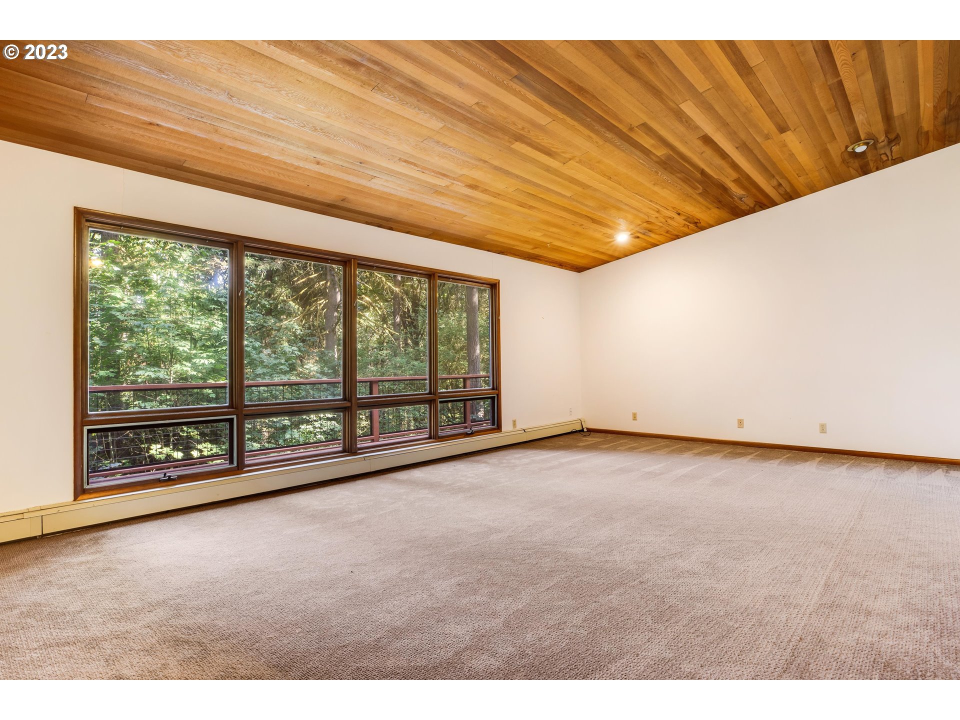 15729 Northwest Sheltered Nook Road Portland, OR 97231 - Photo 25 of 44 a view of an empty room with a window
