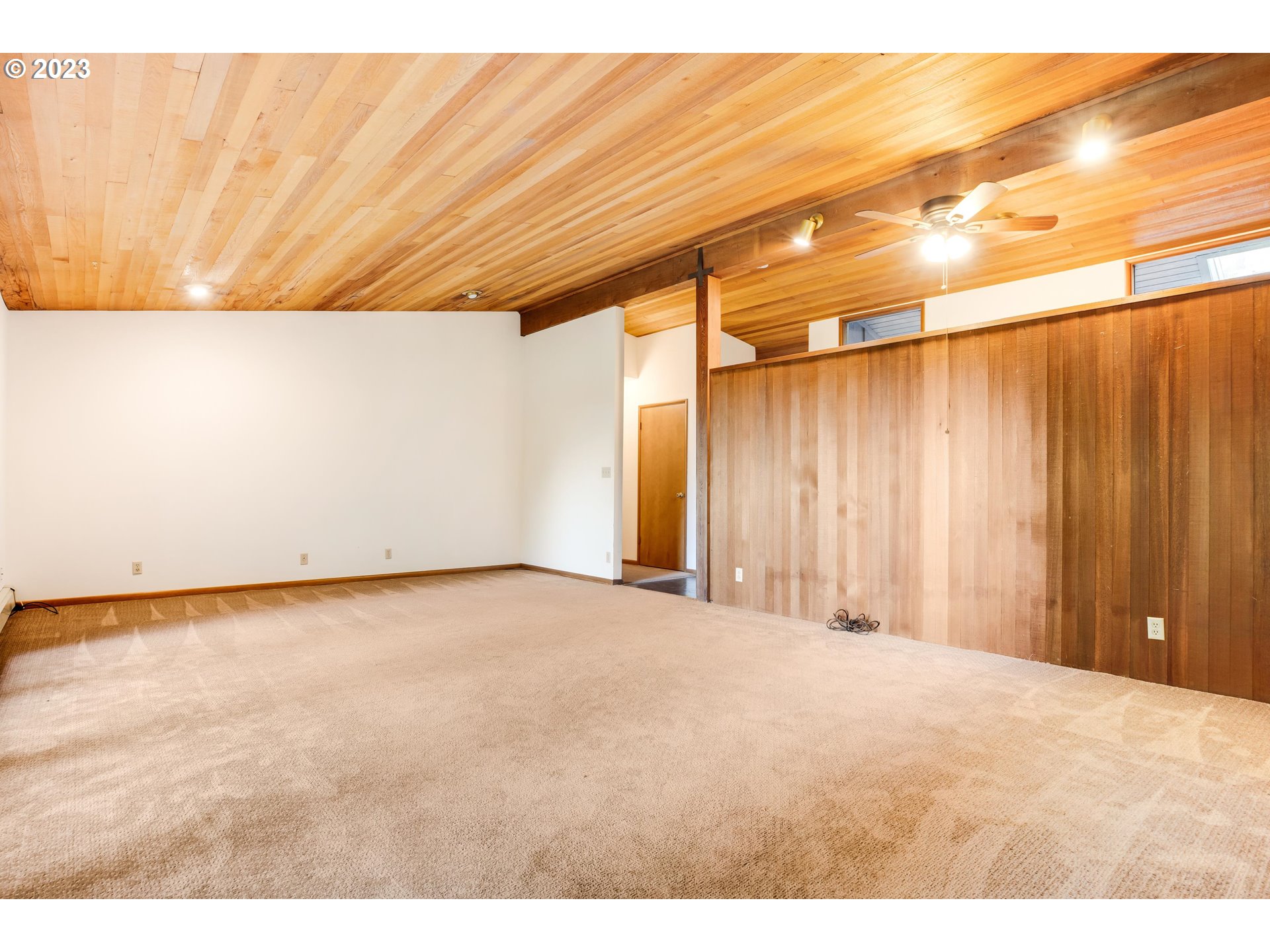 15729 Northwest Sheltered Nook Road Portland, OR 97231 - Photo 26 of 44 a view of an empty room with a window