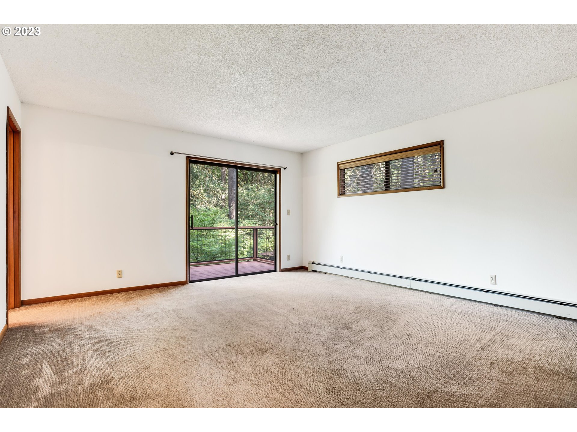 15729 Northwest Sheltered Nook Road Portland, OR 97231 - Photo 27 of 44 a view of an empty room with a window