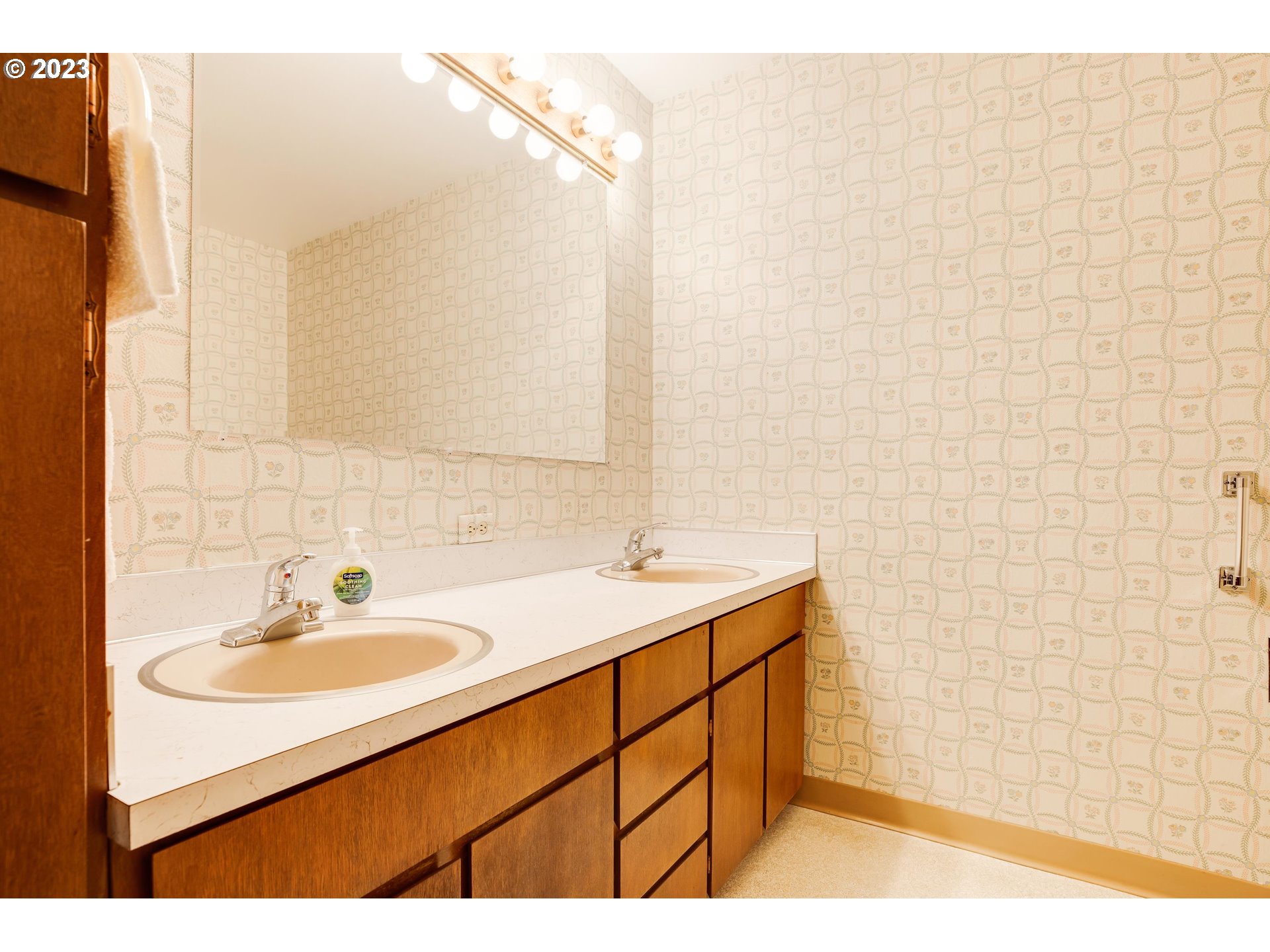 15729 Northwest Sheltered Nook Road Portland, OR 97231 - Photo 32 of 44 a bathroom with a sink and a mirror