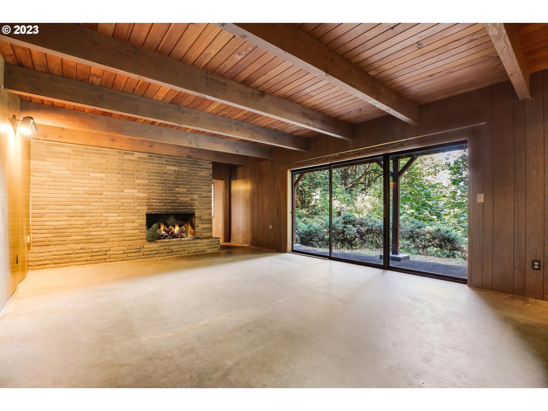15729 Northwest Sheltered Nook Road Portland, OR 97231 - Photo 34 of 44 a view of empty room with floor to ceiling window