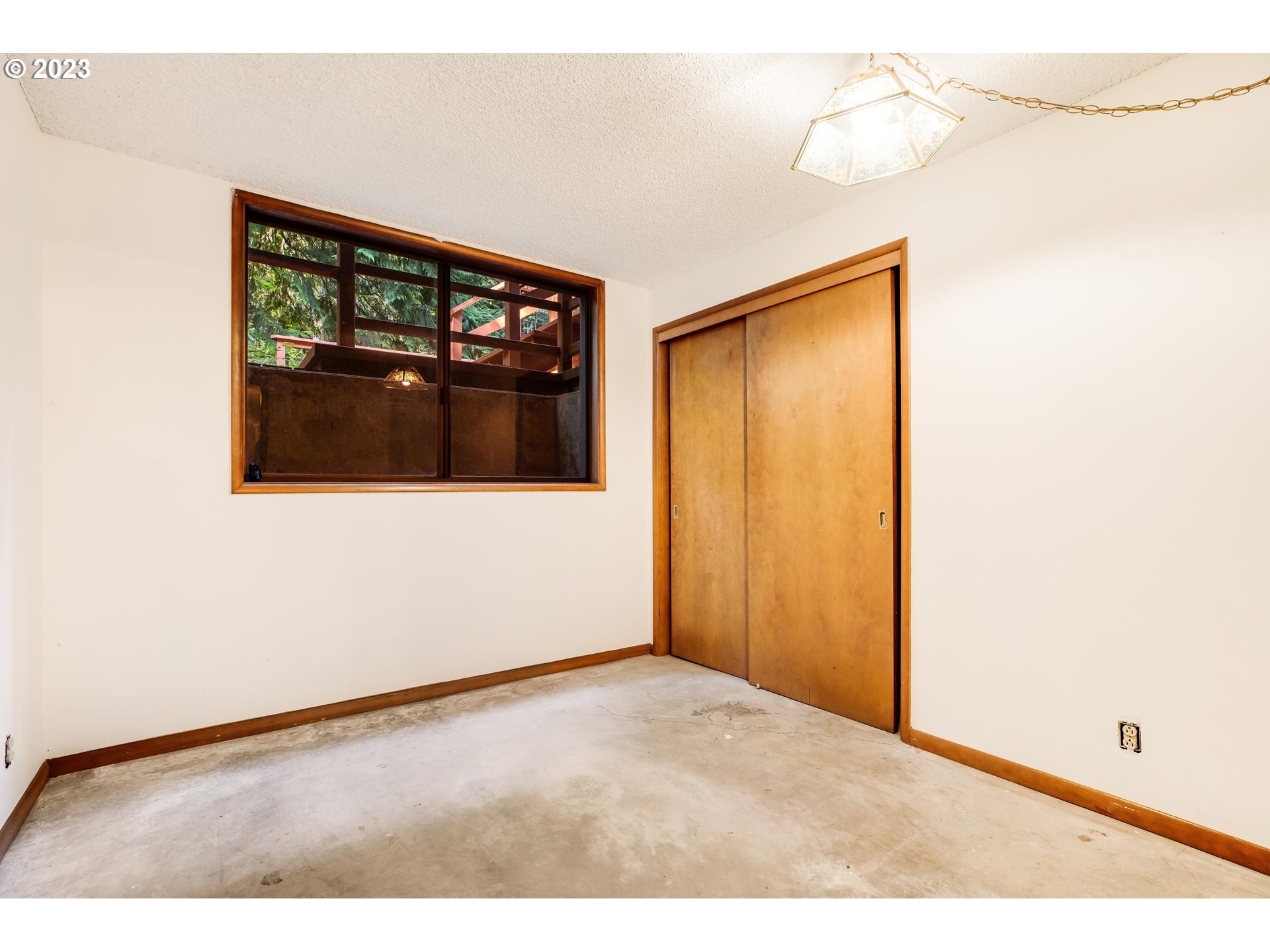 15729 Northwest Sheltered Nook Road Portland, OR 97231 - Photo 38 of 44 a view of an empty room with a window