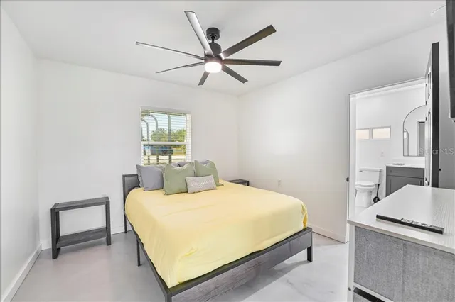 a bedroom with a bed and a dresser