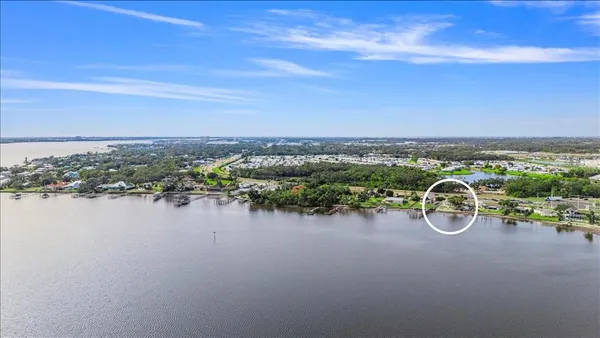 a view of a lake with furniture