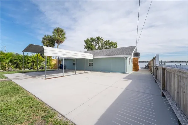 a view of a swimming pool with a patio