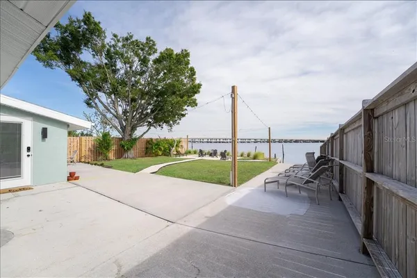 a view of a swimming pool with a patio