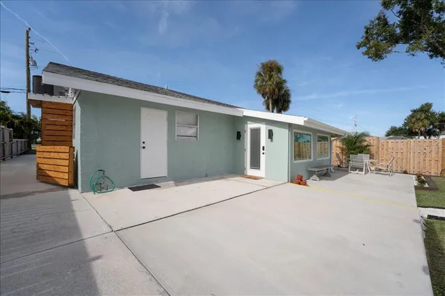 a view of a swimming pool with a patio