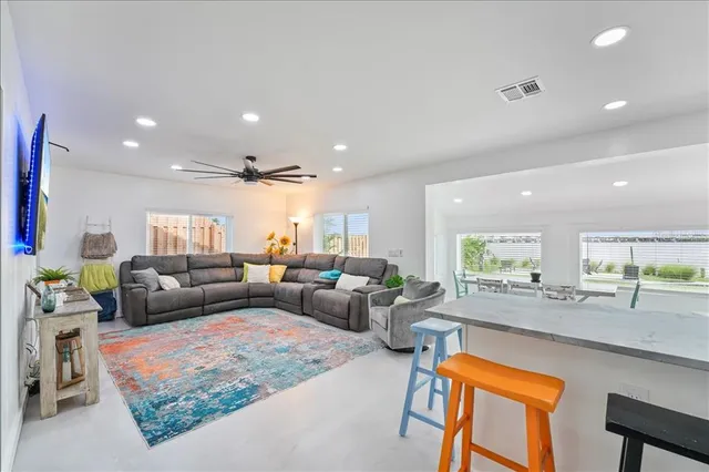 a living room with furniture and a table