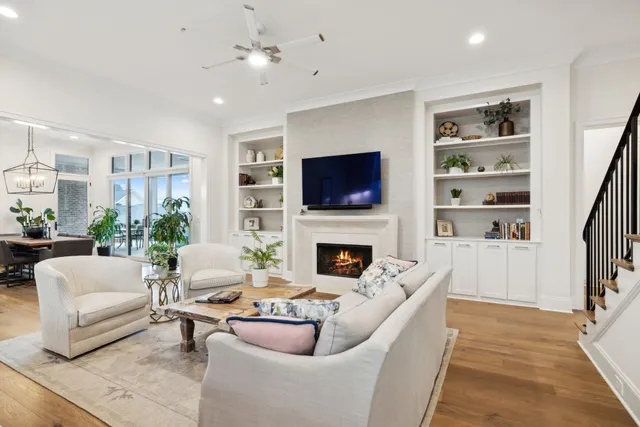 a living room with fireplace furniture and a flat screen tv