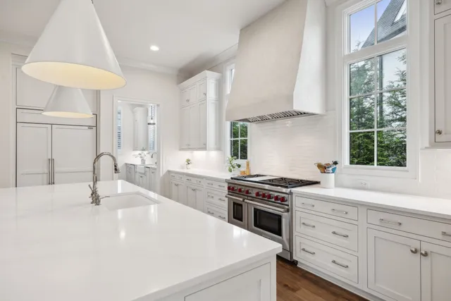 a spacious bedroom with a bed and a large window