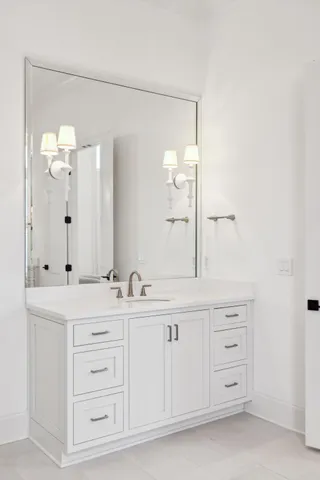 an aerial view of a tennis ground and a cars park side of the road