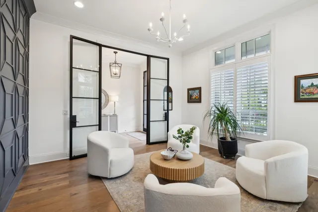 a living room with furniture and a potted plant