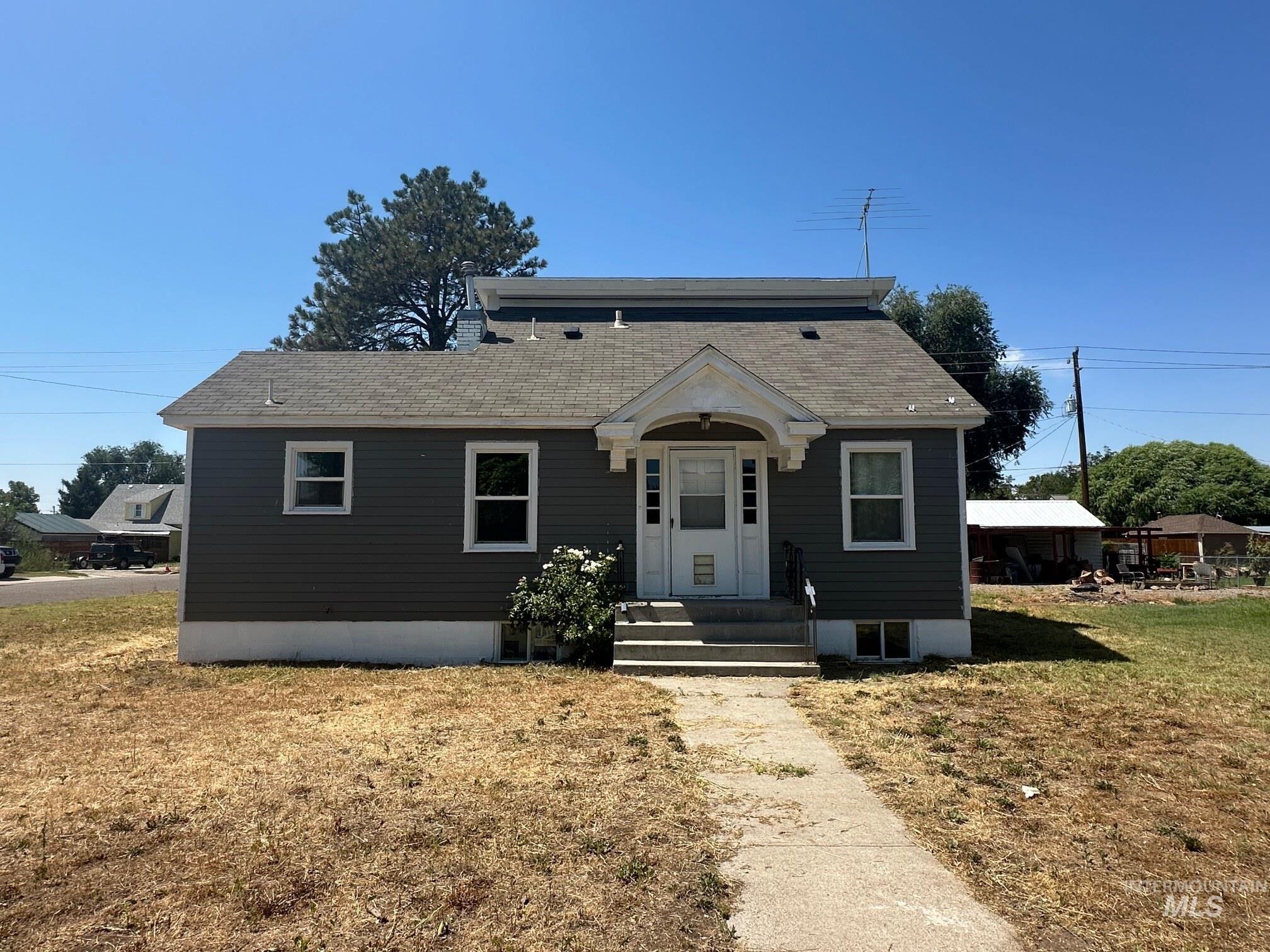 787 Southwest 3rd Street Ontario, OR 97914 - Photo 21 of 22 Bungalow-style home featuring a shingled roof and a front lawn