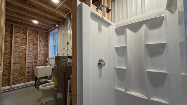 a view of a livingroom with furniture and staircase