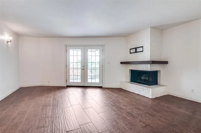a view of a kitchen with a sink and a fireplace