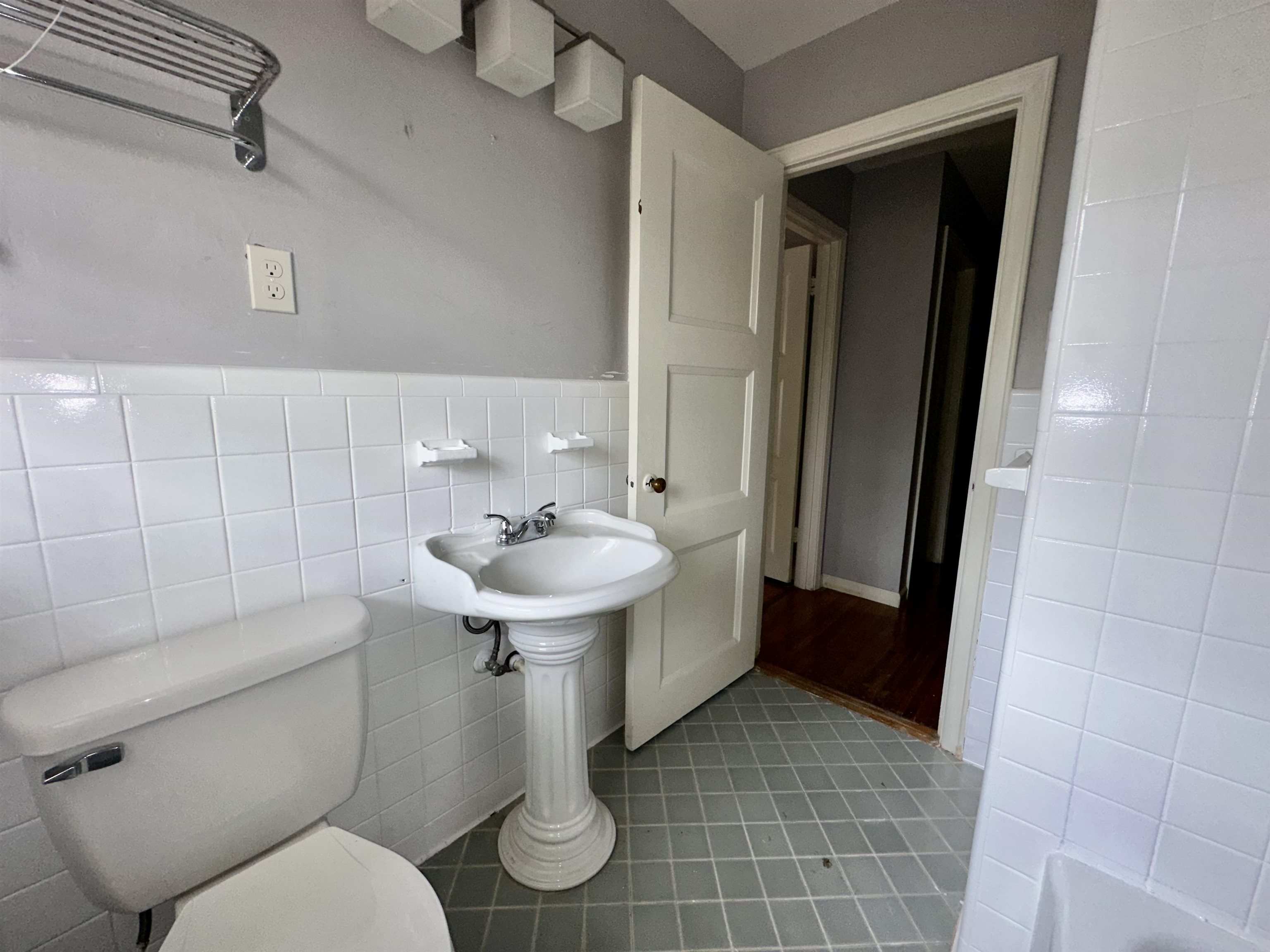 4277 Neely Road Memphis, TN 38109 - Photo 11 of 19 a bathroom with a sink a toilet and shower