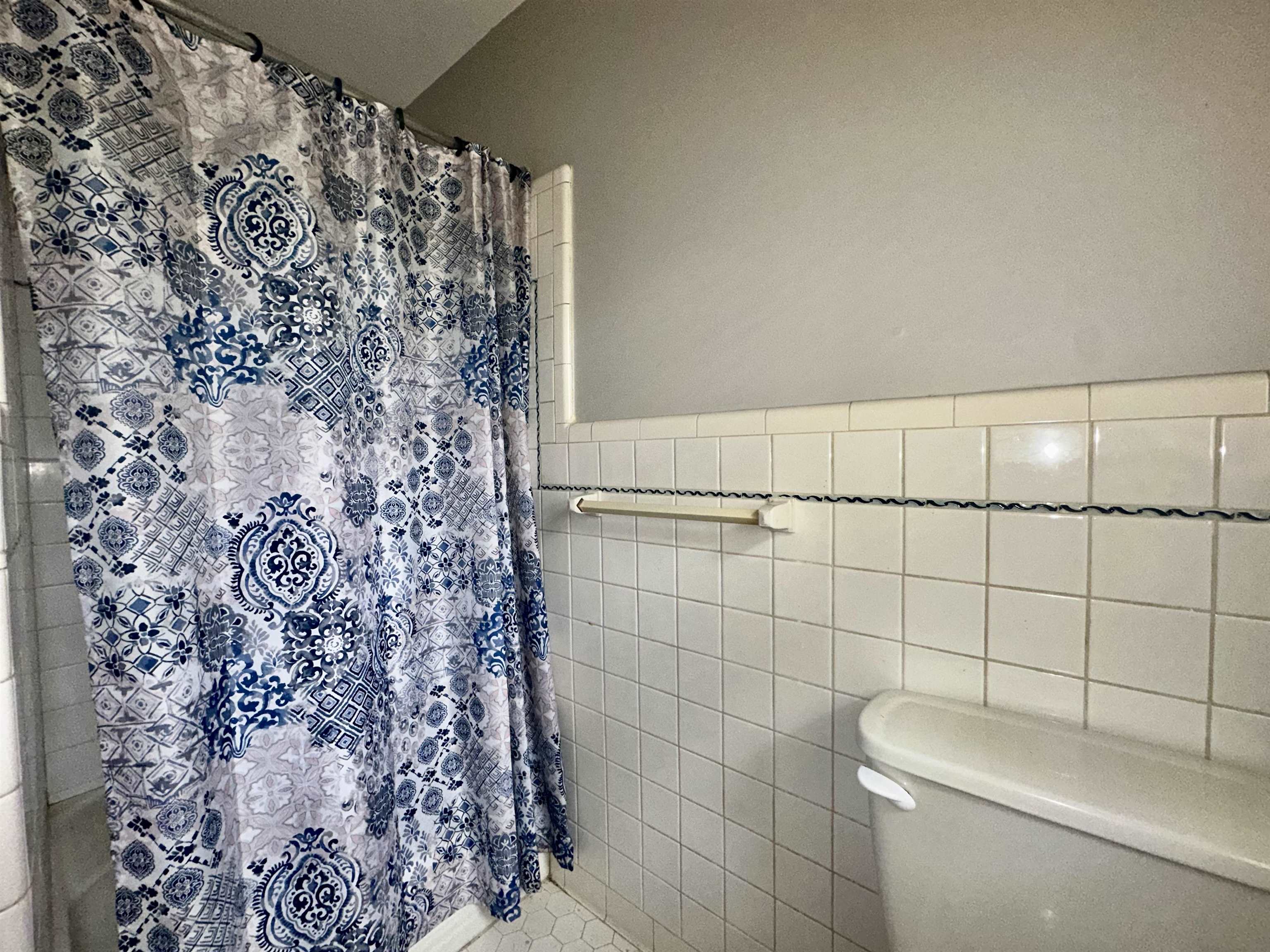 4277 Neely Road Memphis, TN 38109 - Photo 15 of 19 a bathroom with a shower and a toilet