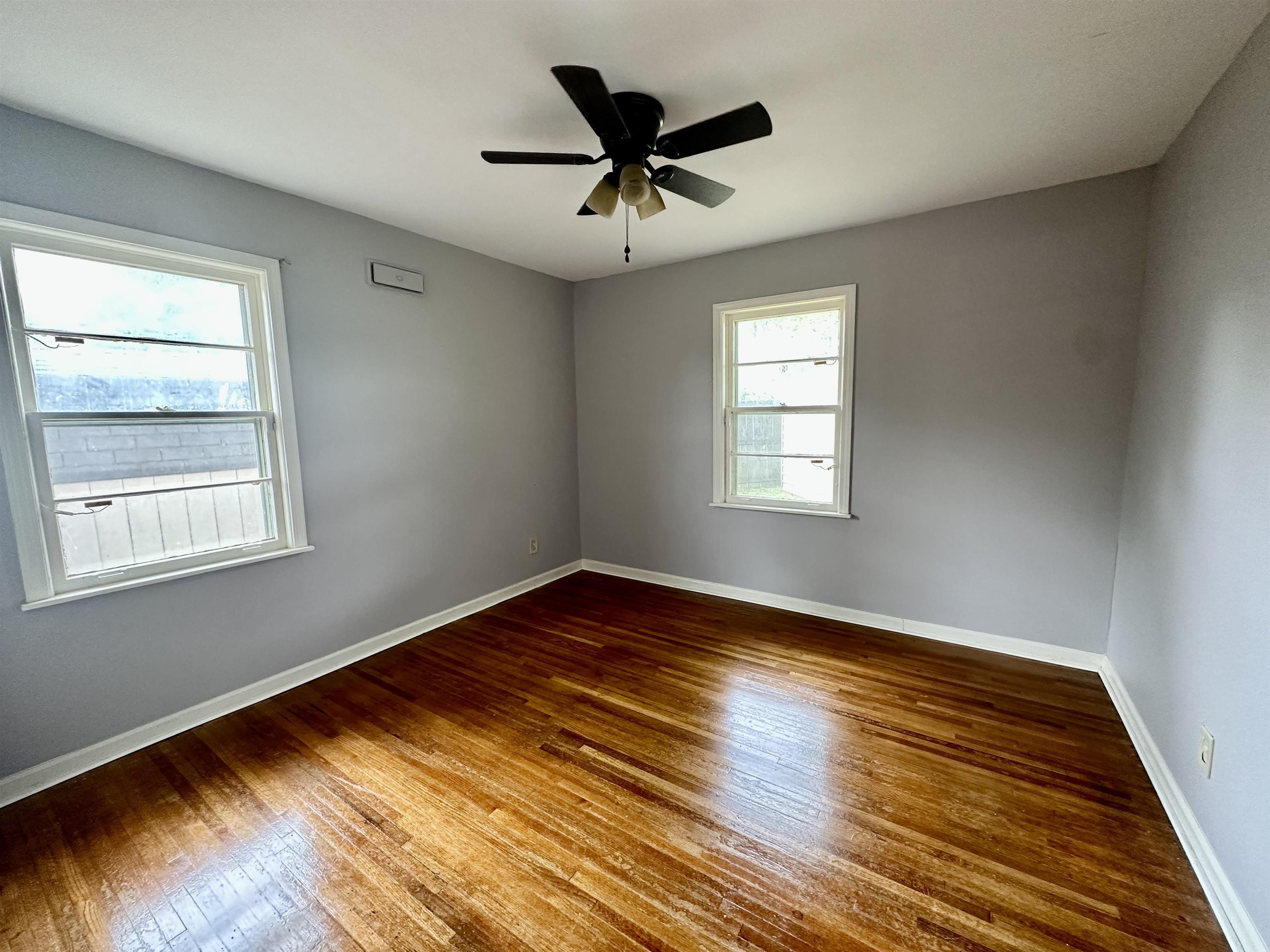 4277 Neely Road Memphis, TN 38109 - Photo 16 of 19 a view of empty room with wooden floor and fan