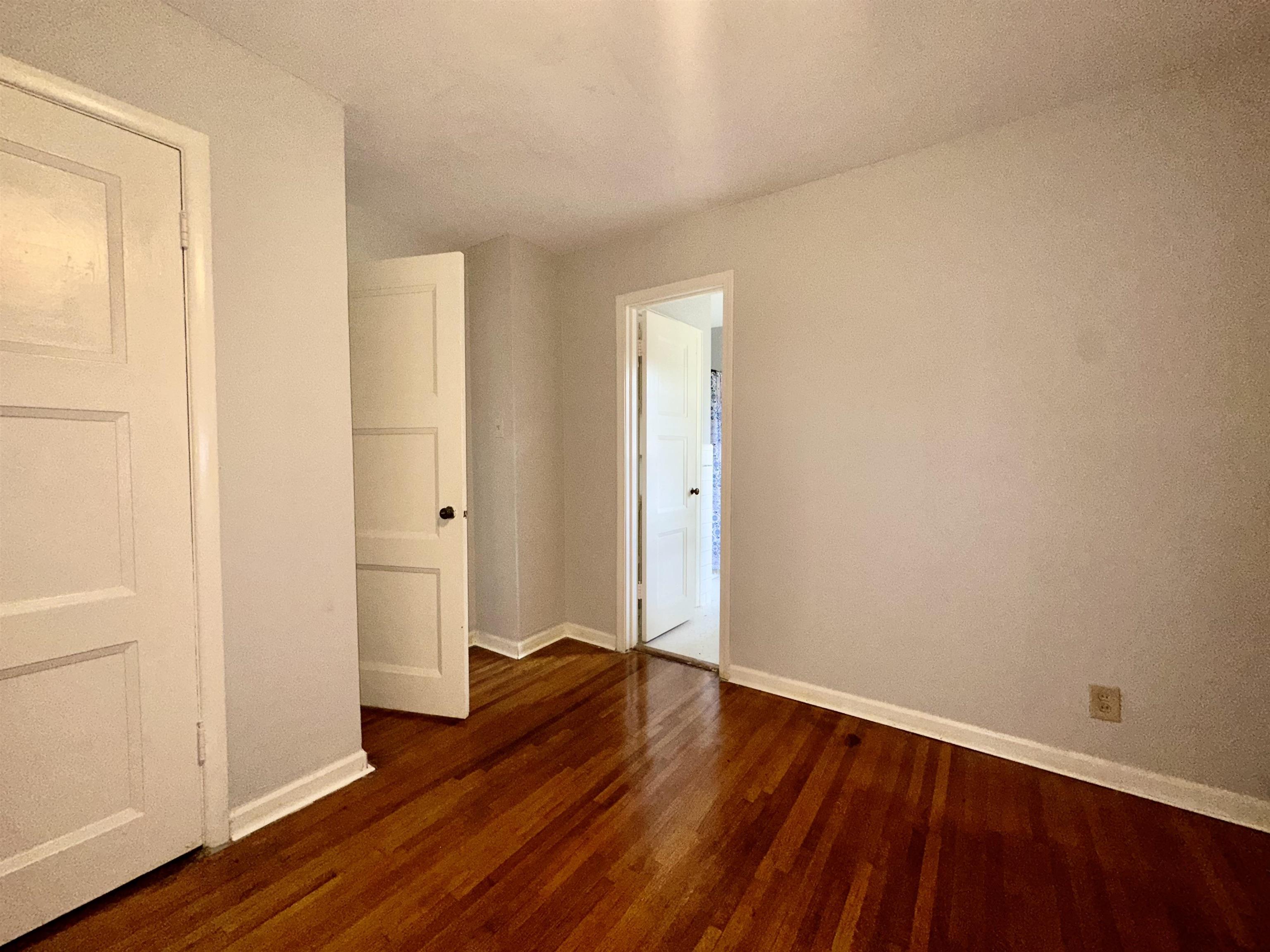 4277 Neely Road Memphis, TN 38109 - Photo 17 of 19 an empty room with wooden floor