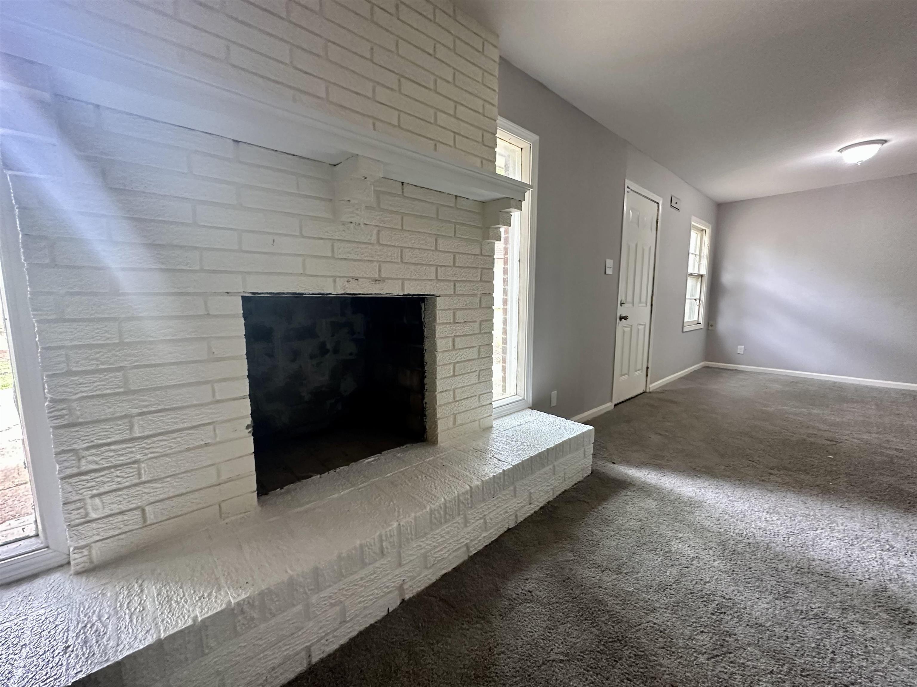 4277 Neely Road Memphis, TN 38109 - Photo 7 of 19 a living room with a fireplace