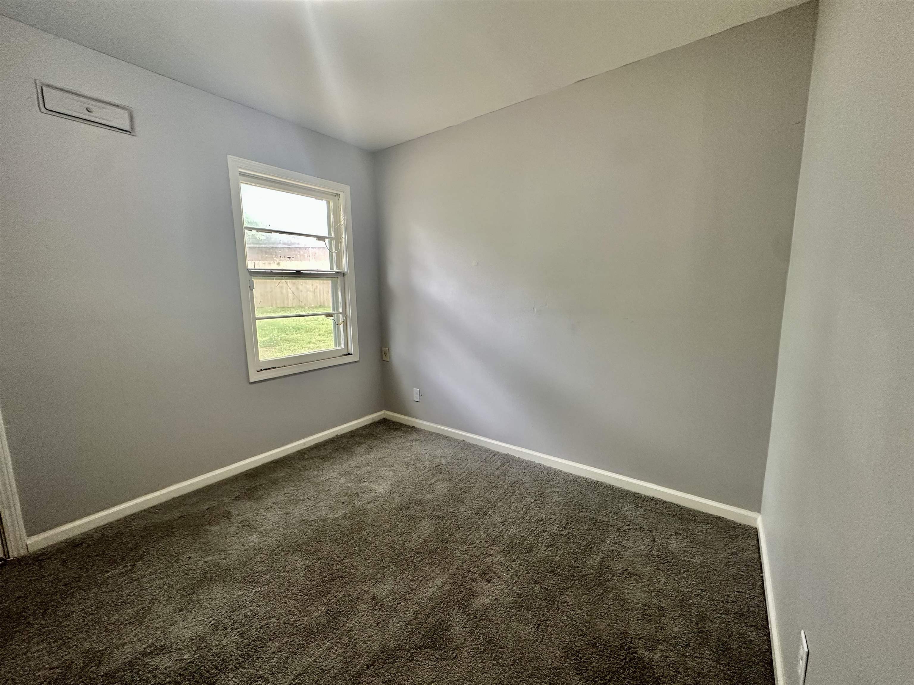 4277 Neely Road Memphis, TN 38109 - Photo 8 of 19 an empty room with windows