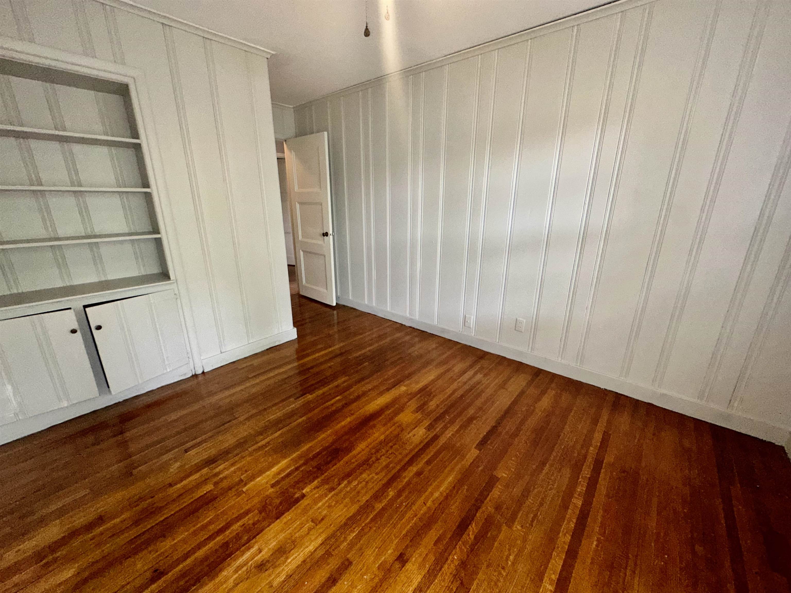 4277 Neely Road Memphis, TN 38109 - Photo 10 of 19 a view of a room with wooden floor and staircase