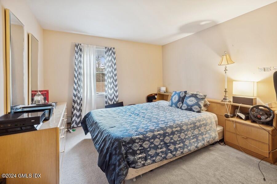 11 Roberta Lane Greenwich, CT 06830 - Photo 13 of 26 a bedroom with a bed and a window