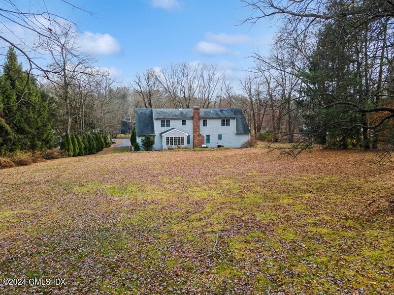 11 Roberta Lane Greenwich, CT 06830 - Photo 20 of 26 a view of a yard with a house