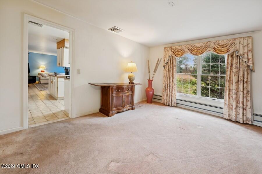 11 Roberta Lane Greenwich, CT 06830 - Photo 8 of 26 a view of a room with large windows