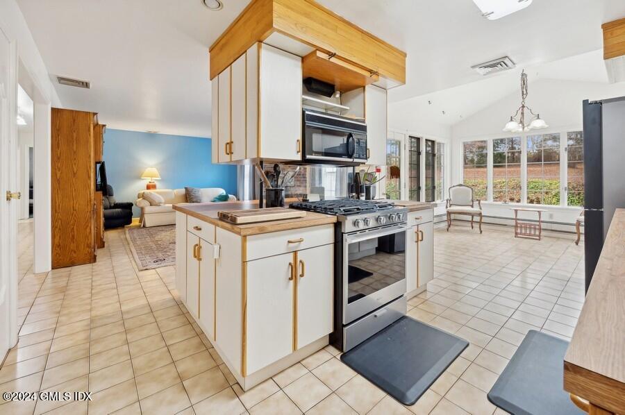 11 Roberta Lane Greenwich, CT 06830 - Photo 9 of 26 a open kitchen with stainless steel appliances granite countertop a stove a sink and a refrigerator