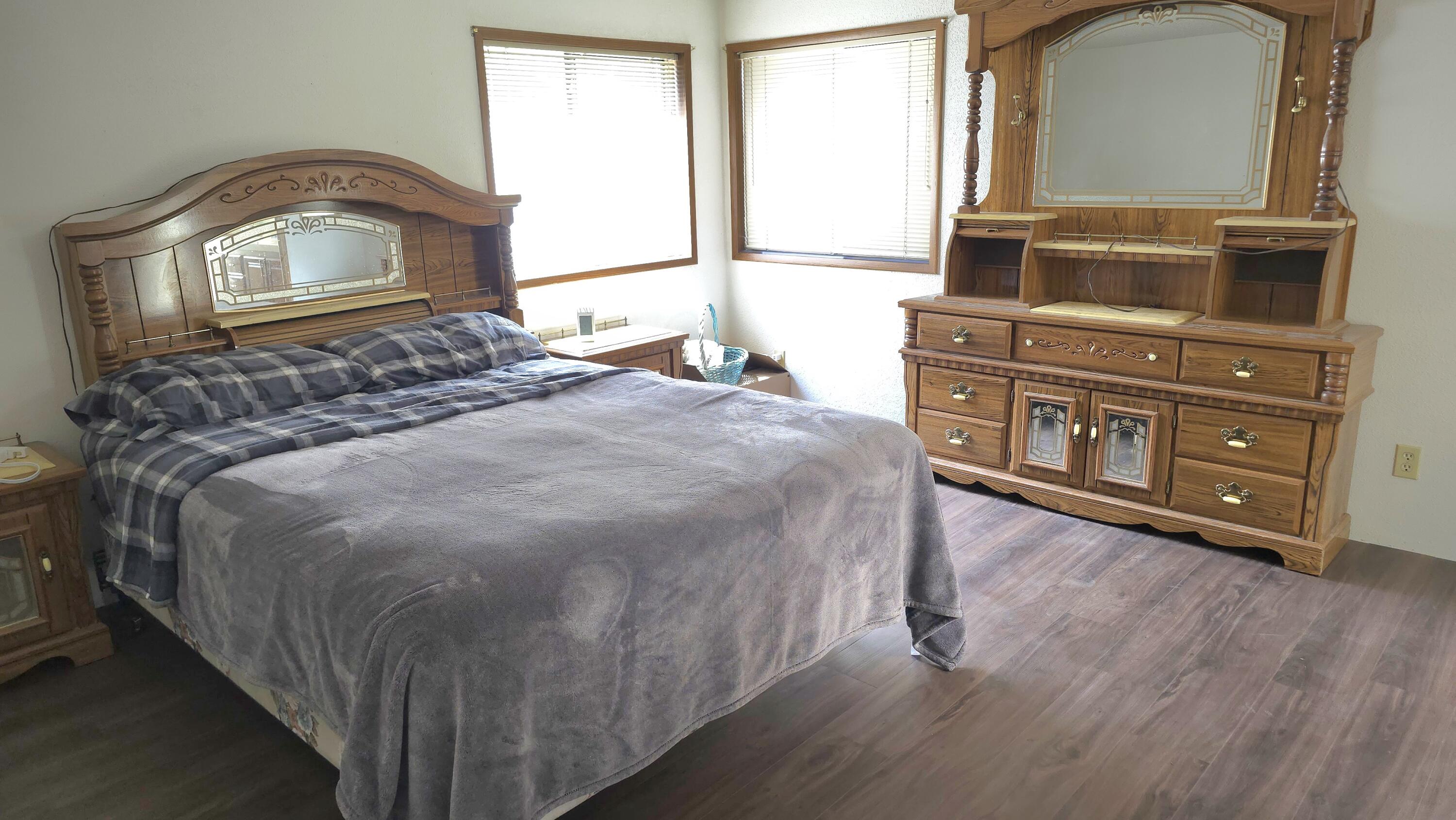16523 Sprague Loop La Pine, OR 97739 - Photo 3 of 16 a bedroom with a bed and a dresser