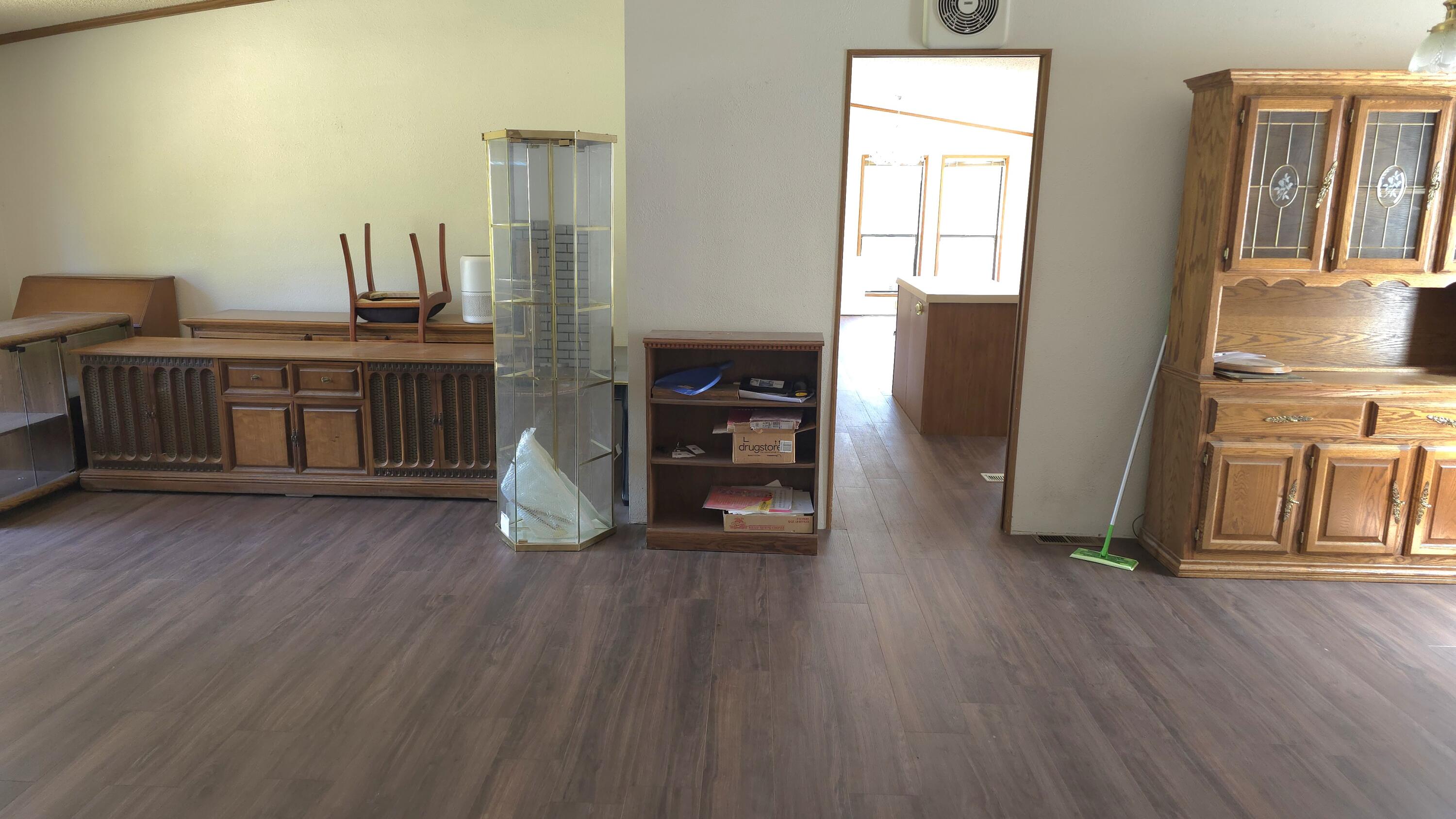 16523 Sprague Loop La Pine, OR 97739 - Photo 5 of 16 a view of a hallway with wooden floor and windows
