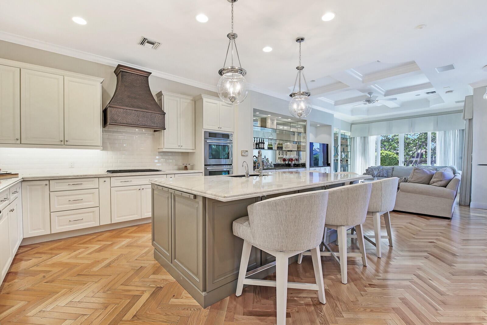 3370 Bridgegate Drive Jupiter, FL 33477 - Photo 12 of 55 a kitchen with stainless steel appliances kitchen island granite countertop a stove a sink a oven a dining table and chairs