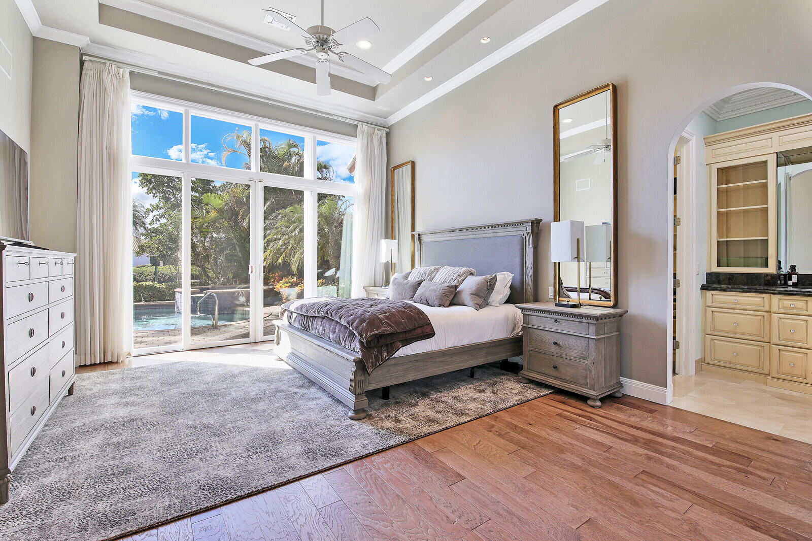 3370 Bridgegate Drive Jupiter, FL 33477 - Photo 17 of 55 a spacious bedroom with a large bed and a large window