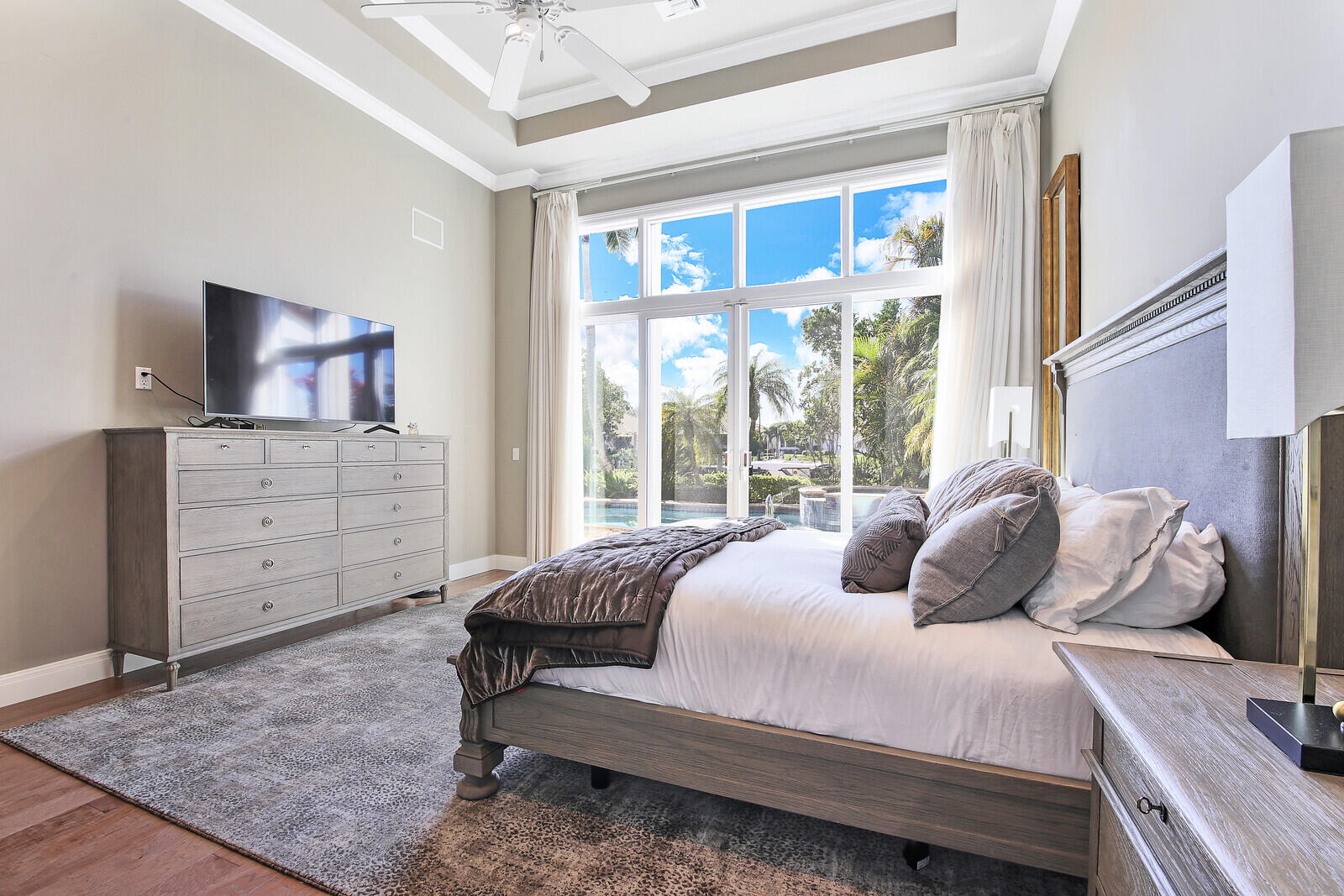 3370 Bridgegate Drive Jupiter, FL 33477 - Photo 18 of 55 a bedroom with a bed and a dresser