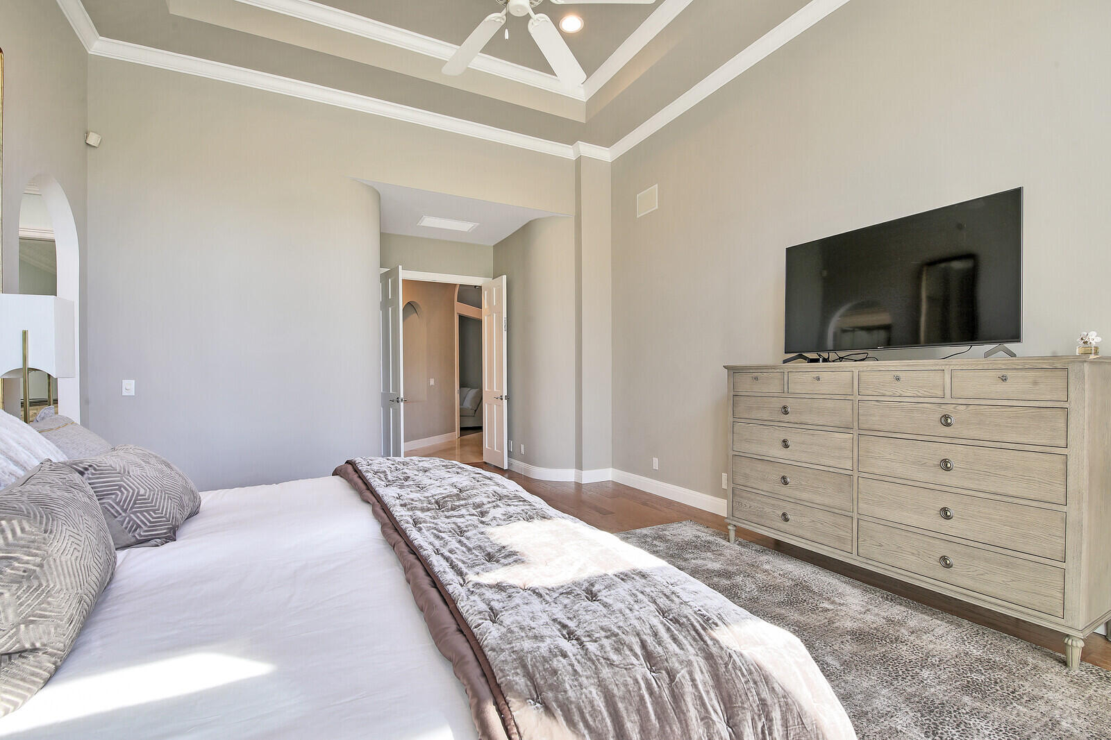 3370 Bridgegate Drive Jupiter, FL 33477 - Photo 19 of 55 a bedroom with a bed and a flat screen tv