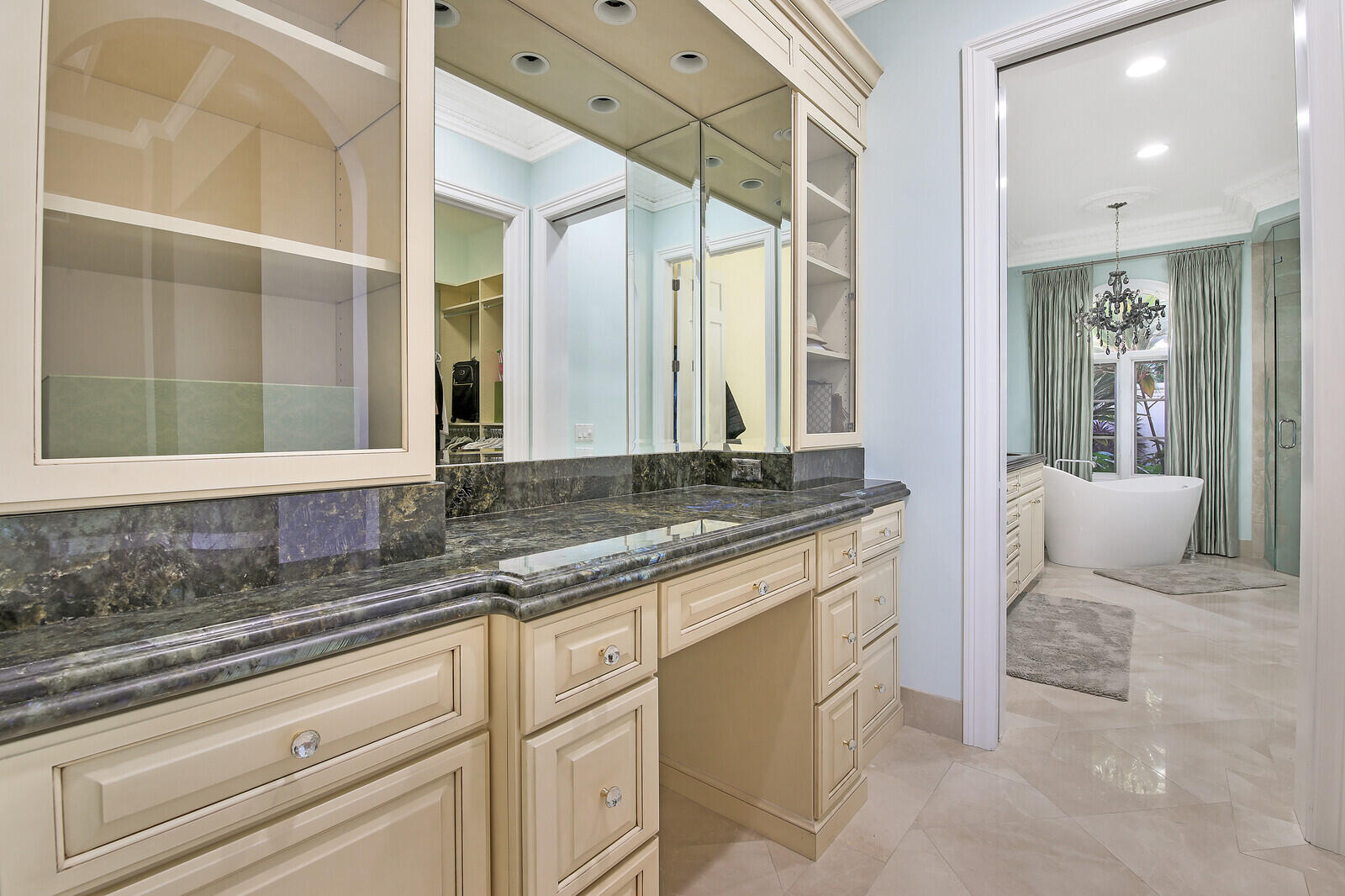 3370 Bridgegate Drive Jupiter, FL 33477 - Photo 20 of 55 a bathroom with a granite countertop sink and a large mirror