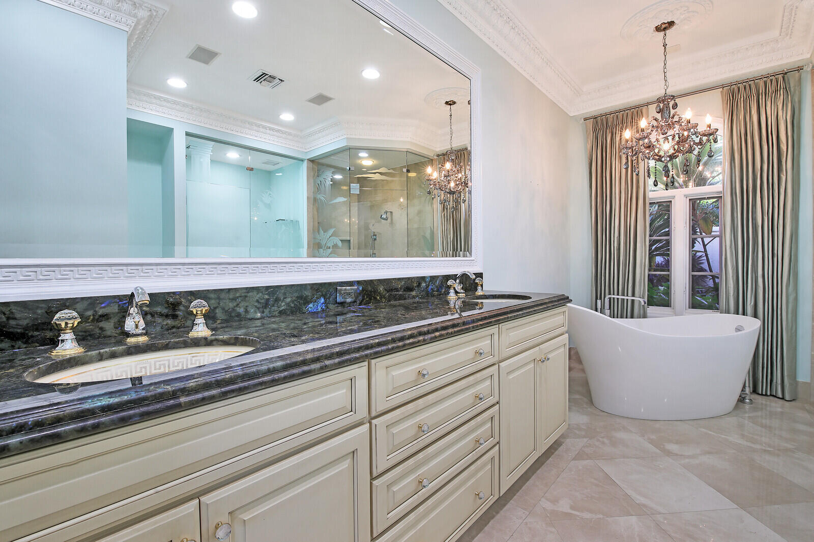 3370 Bridgegate Drive Jupiter, FL 33477 - Photo 21 of 55 a bathroom with a double vanity sink and a bathtub