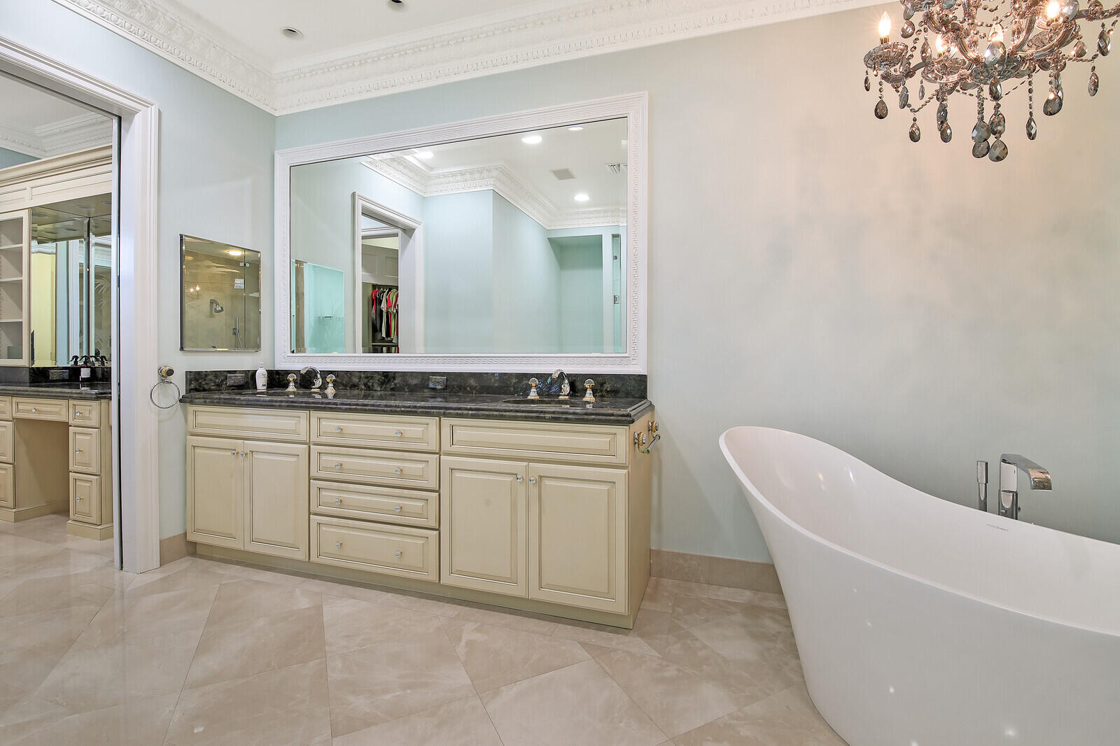 3370 Bridgegate Drive Jupiter, FL 33477 - Photo 23 of 55 a bathroom with a granite countertop sink and a mirror